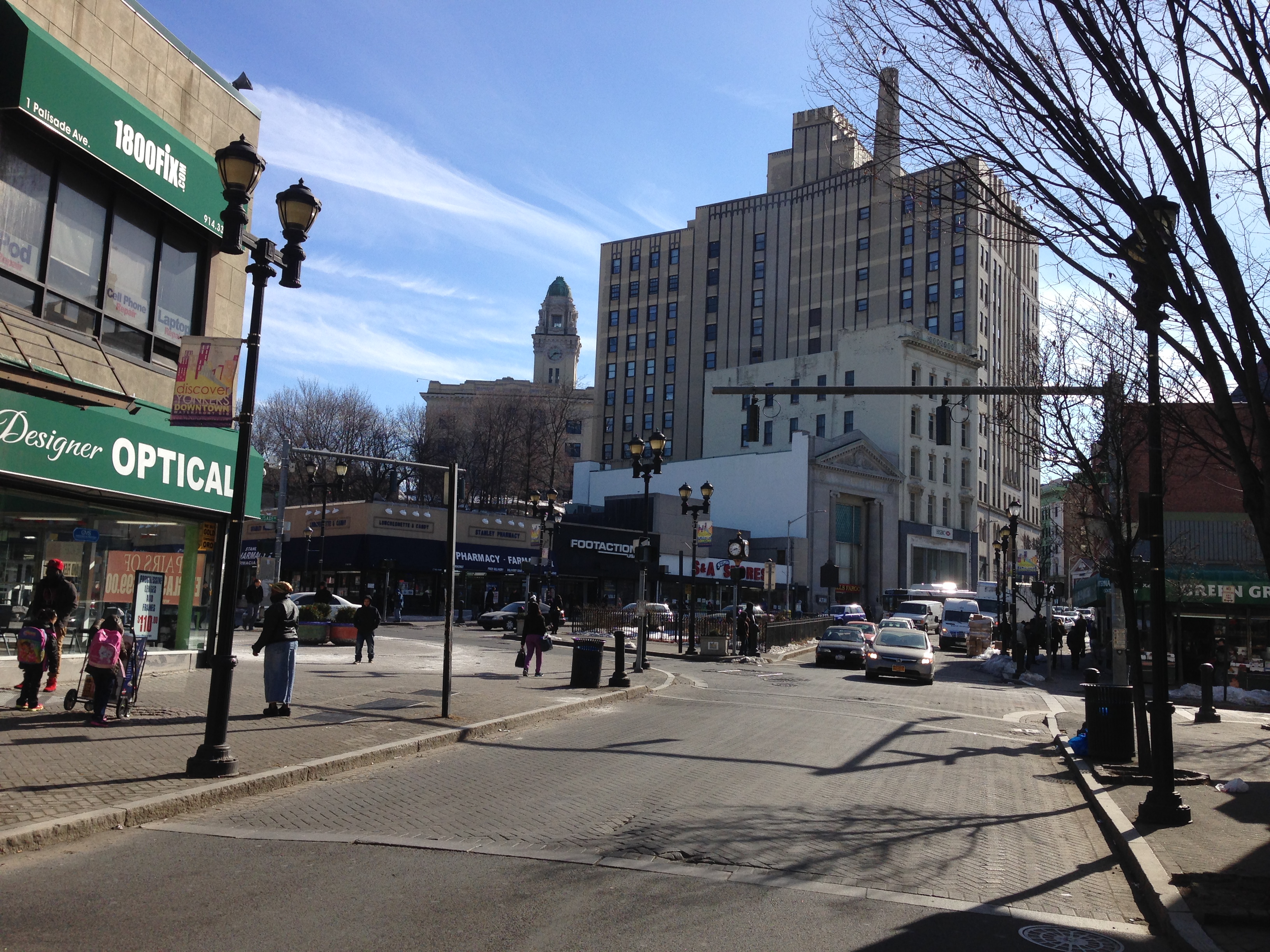Pedestrians, storefronts and traffic in Getty Square, Yonkers